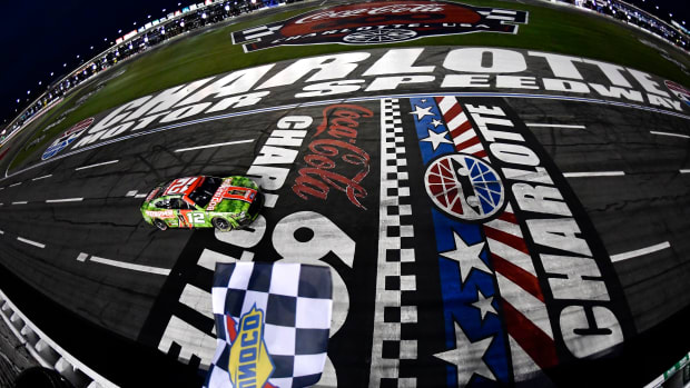 Ryan Blaney takes the checkered flag to win Monday's NASCAR Cup Series Coca-Cola 600 at Charlotte Motor Speedway. (Photo by Logan Riely/Getty Images)